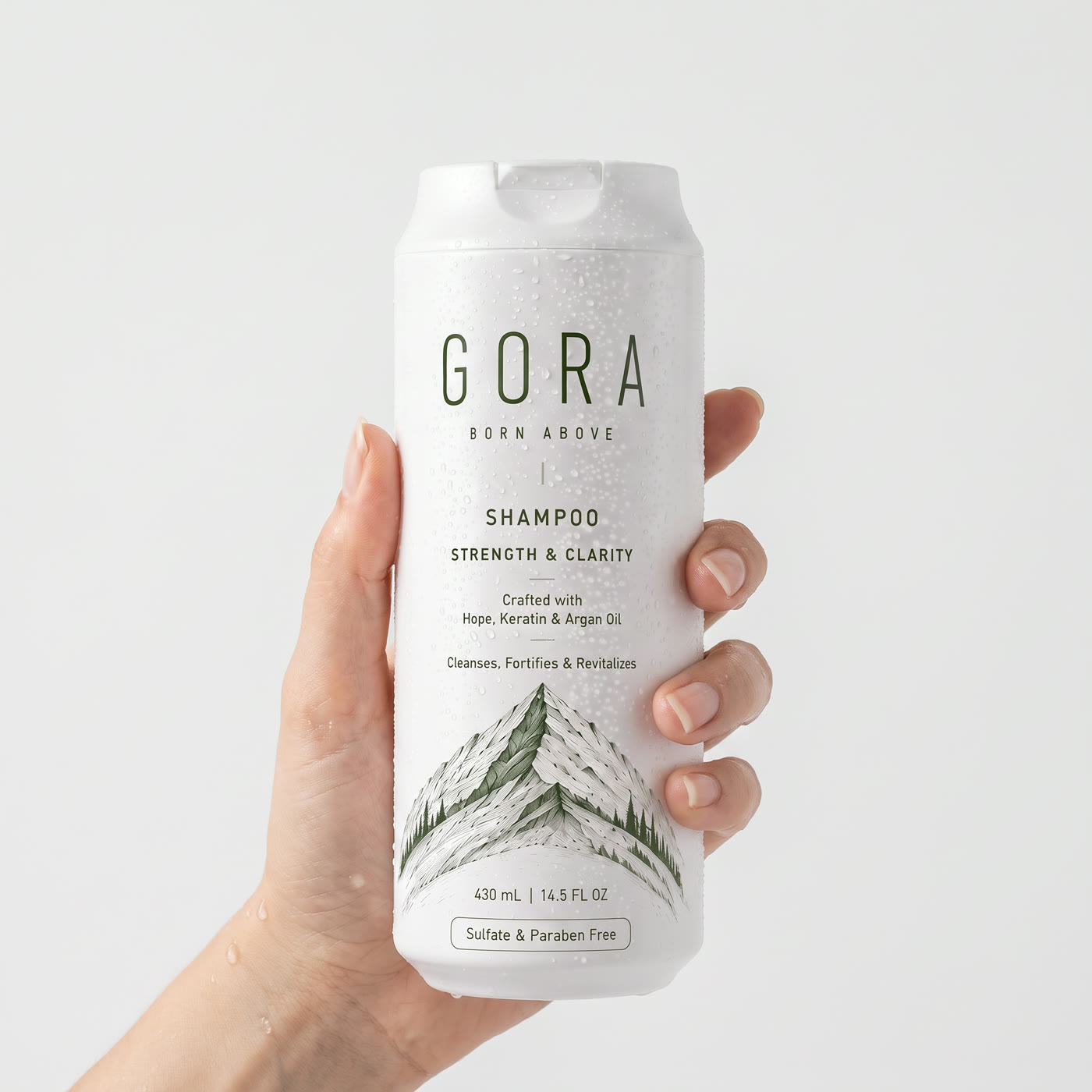 GORA Strengthening Shampoo held in hand